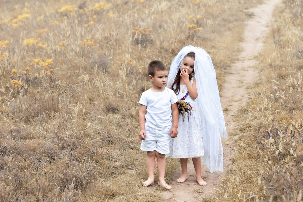 Young bride and groom playing wedding