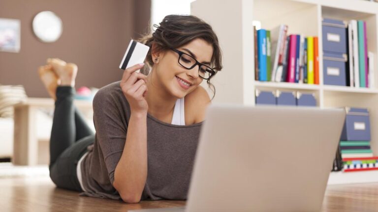 Happy woman doing online shopping at home