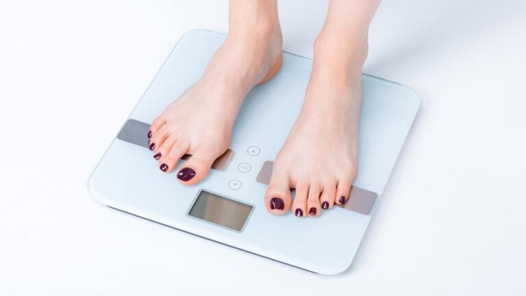 woman standing on digital scales