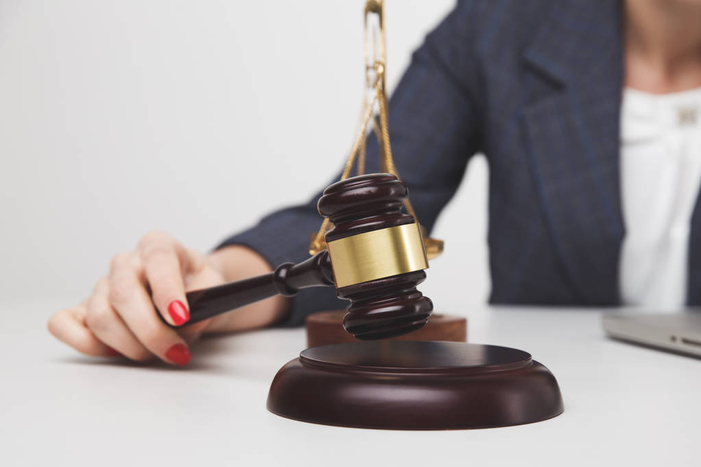 Woman notary with wooden gavel isolated