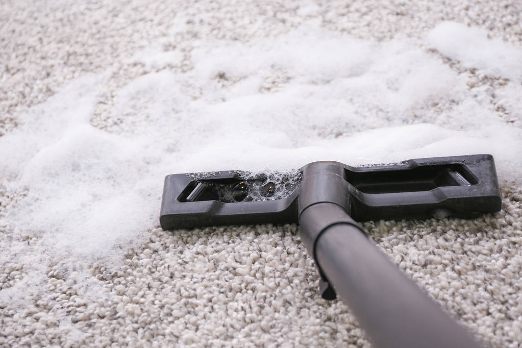 Washing of carpet with vacuum cleaner 