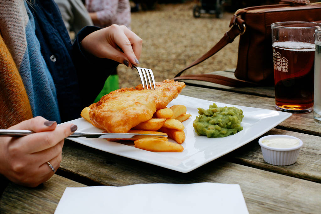 Woman eating fish 